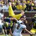 Michigan defensive end Matthew Godin flips over Central Michigan halfback Saylor Lavallii during the first half at Michigan Stadium on Saturday, August 31, 2013. Melanie Maxwell | AnnArbor.com
